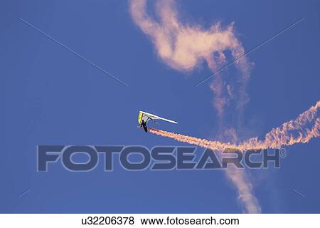 Stock Photo - "Hang glider during opening ceremony, July 4, Independence Day Parade, Telluride, Colorado, USA". Fotosearch