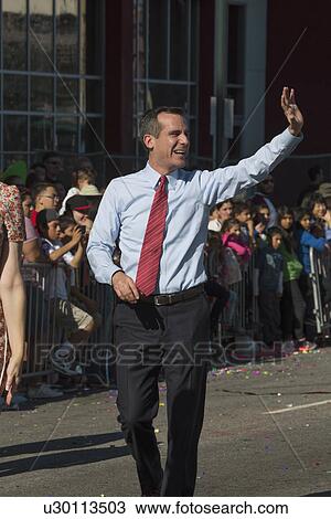 Stock Image - "Los Angeles Mayor Eric Garcetti and wife, Jacque McMillan march in 115th Golden Dragon Parade, Chinese New Year, Los Angeles, California, USA". Fotosearch