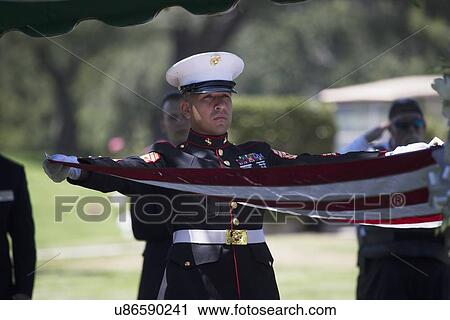 "Marine folding flag at Memorial Service for fallen US Soldier, PFC Zach Suarez, ""Honor Mission"" on Highway 23, drive to Memorial Service, Westlake Village, California, USA" View Large Photo Image Stock Image - "Marine folding flag at Memorial Service for fallen US Soldier, PFC Zach Suarez, ""Honor Mission"" on Highway 23, drive to Memorial Service, Westlake Village, California, USA". Fotosearch