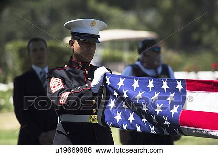 "Marine folds flag at Memorial Service for fallen US Soldier, PFC Zach Suarez, ""Honor Mission"" on Highway 23, drive to Memorial Service, Westlake Village, California, USA" View Large Photo Image Stock Photograph - "Marine folds flag at Memorial Service for fallen US Soldier, PFC Zach Suarez, ""Honor Mission"" on Highway 23, drive to Memorial Service, Westlake Village, California, USA". Fotosearch