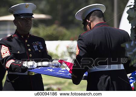 "Marine folds flag at Memorial Service for fallen US Soldier, PFC Zach Suarez, ""Honor Mission"" on Highway 23, drive to Memorial Service, Westlake Village, California, USA" View Large Photo Image Stock Photograph - "Marine folds flag at Memorial Service for fallen US Soldier, PFC Zach Suarez, ""Honor Mission"" on Highway 23, drive to Memorial Service, Westlake Village, California, USA". Fotosearch