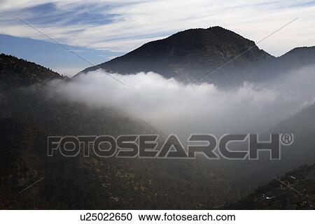 Stock Image - "Morning clouds below mountains, Pine Mountain California, USA". Fotosearch