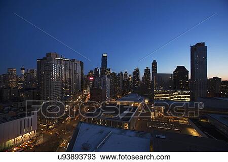 "New York City skyline at dusk looking south down Broadway from Lincoln Center, New York City, New York, USA" View Large Photo Image Stock Image - "New York City skyline at dusk looking south down Broadway from Lincoln Center, New York City, New York, USA". Fotosearch