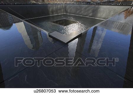 Stock Image - "One World Trade Center (1WTC), Freedom Tower reflections and Footprint of WTC, National September 11 Memorial, New York City, New York, USA". Fotosearch