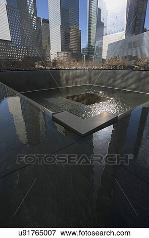 Stock Photo - "One World Trade Center (1WTC), Freedom Tower reflections and Footprint of WTC, National September 11 Memorial, New York City, New York, USA". Fotosearch