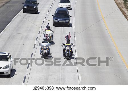 Stock Photo - "Patriot Guard Motorcyclists honoring fallen US Soldier, PFC Zach Suarez, ""Honor Mission"" on Highway 23, drive to Memorial Service, Westlake Village, California, USA". Fotosearch