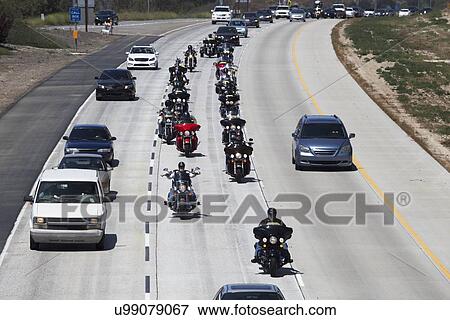 Stock Photo - "Patriot Guard Motorcyclists honoring fallen US Soldier, PFC Zach Suarez, ""Honor Mission"" on Highway 23, drive to Memorial Service, Westlake Village, California, USA". Fotosearch