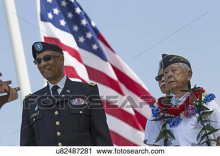 Stock Image - "Ret. Milton S. Herring left and Ret. Lt. Yoshito Fujimoto and US Flag, Los Angeles National Cemetery Annual Memorial Event, May 26, 2014, California, USA". Fotosearch