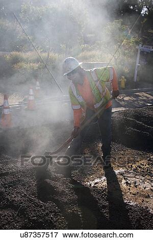"Roadworker repaves road with steam, Encino Drive, Oak View, California, USA" View Large Photo Image Stock Photo - "Roadworker repaves road with steam, Encino Drive, Oak View, California, USA". Fotosearch