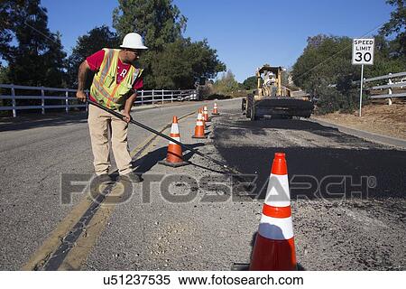 "Roadworker repaves road with steam, Encino Drive, Oak View, California, USA" View Large Photo Image Stock Photography - "Roadworker repaves road with steam, Encino Drive, Oak View, California, USA". Fotosearch