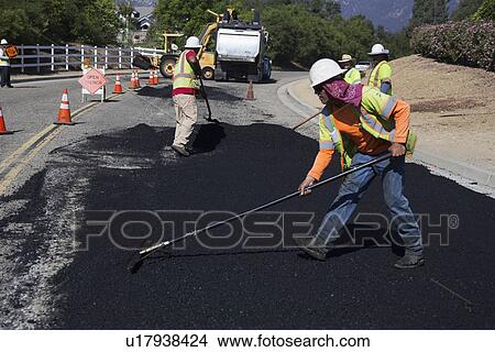 Picture - "Roadworkers repaves road with steam, Encino Drive, Oak View, California, USA". Fotosearch
