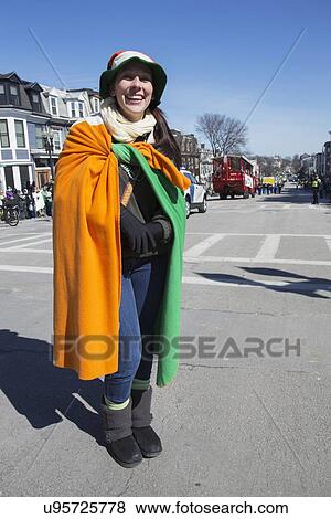 "Smiling woman draped with Irish flag, St. Patrick's Day Parade, 2014, South Boston, Massachusetts, USA" View Large Photo Image Stock Photo - "Smiling woman draped with Irish flag, St. Patrick's Day Parade, 2014, South Boston, Massachusetts, USA". Fotosearch