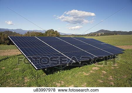 Stock Photo - "Solar panels and green grass, Oak View, California, USA". Fotosearch
