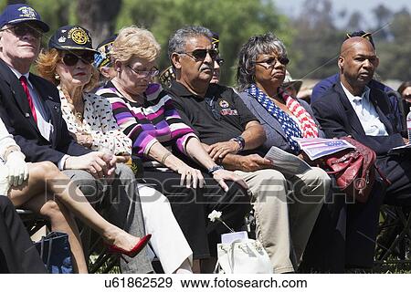Stock Photo - "Solemn audience at Los Angeles National Cemetery Annual Memorial Event, May 26, 2014, California, USA". Fotosearch