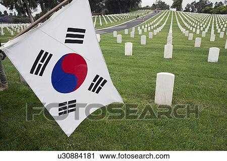 Stock Image - "South Korean flag hanging at 2014 Memorial Day Event, Los Angeles National Cemetery, California, USA". Fotosearch