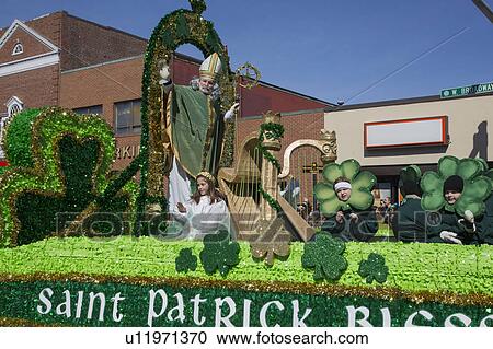 Stock Image - "St. Patrick blessing crowd, St. Patrick's Day Parade, 2014, South Boston, Massachusetts, USA". Fotosearch