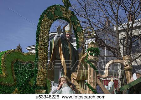 Stock Photograph - "St. Patrick blessing crowd, St. Patrick's Day Parade, 2014, South Boston, Massachusetts, USA". Fotosearch