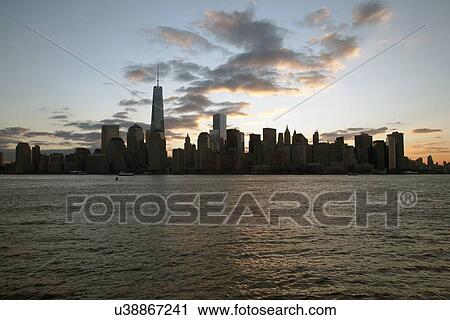 Stock Image - "Sunrise on One World Trade Center (1WTC), Freedom Tower, New York City skyline, New York City, New York, USA". Fotosearch