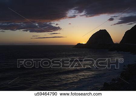 Stock Image - "Sunset at Point Mugu, Pacific Ocean, Malibu, Los Angeles, California, USA". Fotosearch