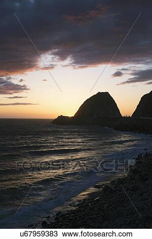 Stock Image - "Sunset at Point Mugu, Pacific Ocean, Malibu, Los Angeles, California, USA". Fotosearch