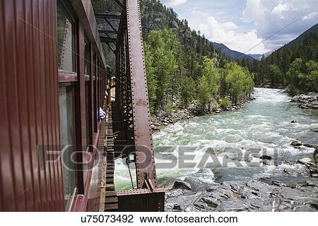 "The Durango and Silverton Narrow Gauge Railroad Steam Engine travels along Animas River, Colorado, USA" View Large Photo Image Stock Image - "The Durango and Silverton Narrow Gauge Railroad Steam Engine travels along Animas River, Colorado, USA". Fotosearch