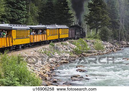"The Durango and Silverton Narrow Gauge Railroad Steam Engine travels along Animas River, Colorado, USA" View Large Photo Image Stock Photo - "The Durango and Silverton Narrow Gauge Railroad Steam Engine travels along Animas River, Colorado, USA". Fotosearch