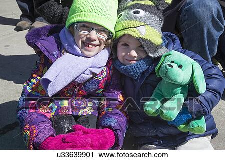 "Two girls smile, St. Patrick's Day Parade, 2014, South Boston, Massachusetts, USA" View Large Photo Image Stock Image - "Two girls smile, St. Patrick's Day Parade, 2014, South Boston, Massachusetts, USA". Fotosearch