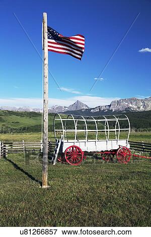 "US Flag and covered wagon, Hastings Mesa, near Ridgway, Colorado, USA" View Large Photo Image Stock Photo - "US Flag and covered wagon, Hastings Mesa, near Ridgway, Colorado, USA". Fotosearch