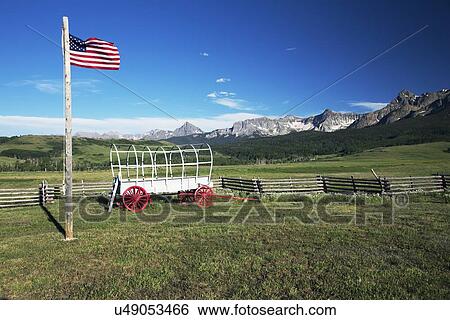 "US Flag and covered wagon, Hastings Mesa, near Ridgway, Colorado, USA" View Large Photo Image Stock Photograph - "US Flag and covered wagon, Hastings Mesa, near Ridgway, Colorado, USA". Fotosearch