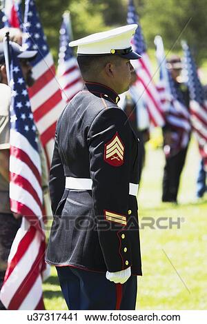 Stock Image - "US Marines stand at attention at Memorial Service for fallen US Soldier, PFC Zach Suarez, ""Honor Mission"" on Highway 23, drive to Memorial Service, Westlake Village, California, USA". Fotosearch