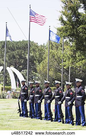 Stock Image - "US Marines stand at attention at Memorial Service for fallen US Soldier, PFC Zach Suarez, ""Honor Mission"" on Highway 23, drive to Memorial Service, Westlake Village, California, USA". Fotosearch