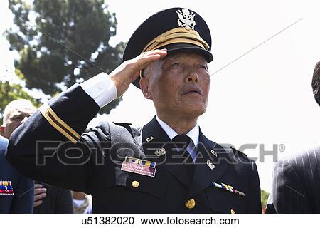 Stock Image - "Veteran saluting at Los Angeles National Cemetery Annual Memorial Event, May 26, 2014, California, USA". Fotosearch