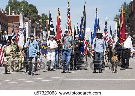 Stock Image - "Veterans march down Main Street, July 4, Independence Day Parade, Telluride, Colorado, USA". Fotosearch