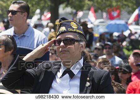 Stock Image - "Veterans saluting at Los Angeles National Cemetery Annual Memorial Event, May 26, 2014, California, USA". Fotosearch