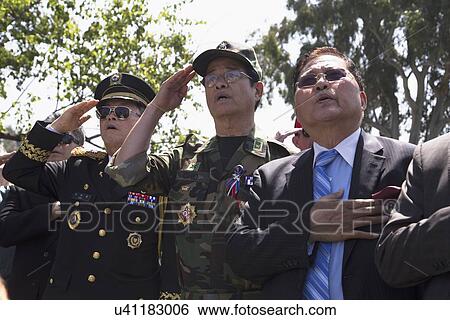 Stock Photograph - "Vets saluting at Los Angeles National Cemetery Annual Memorial Event, May 26, 2014, California, USA". Fotosearch