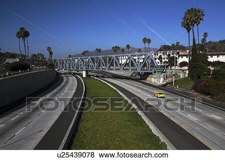 "Yellow Corvette drives Route 101 at California Avenue, Ventura, California, USA" View Large Photo Image Stock Photo - "Yellow Corvette drives Route 101 at California Avenue, Ventura, California, USA". Fotosearch