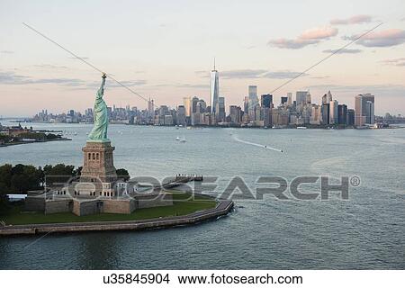 Aerial view of Statue of Liberty and city skyline View Large Photo Image Picture - Aerial view of Statue of Liberty and city skyline. Fotosearch