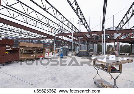 Stock Image - Architectual plans on table. Fotosearch