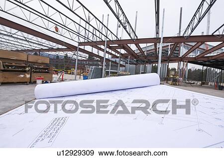 Stock Photo - Architectual plans on table. Fotosearch