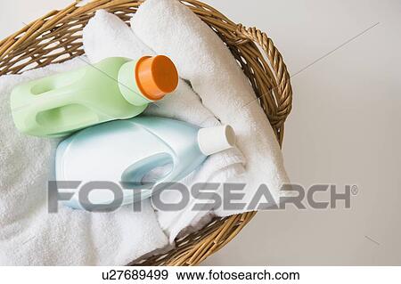 Basket with laundry and detergents View Large Photo Image Stock Photo - Basket with laundry and detergents. Fotosearch