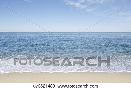 Stock Photo - Beach with blue sky. Fotosearch
