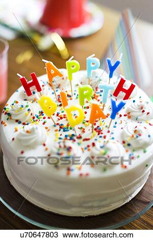 Stock Image - Birthday cake on table. Fotosearch