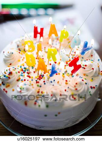 Stock Photo - Birthday cake on table. Fotosearch