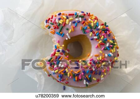 Bite taken out of donut View Large Photo Image Stock Photo - Bite taken out of donut. Fotosearch