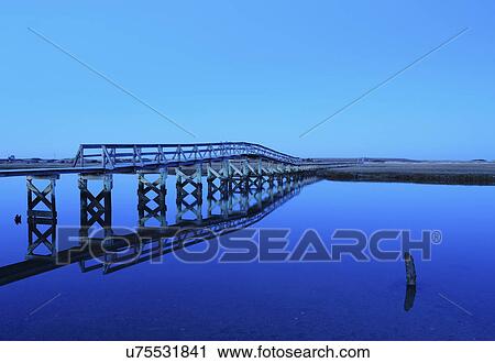 "Bridge reflecting in water, blue image" View Large Photo Image Stock Image - "Bridge reflecting in water, blue image". Fotosearch