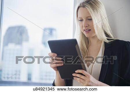 Businesswoman with digital tablet View Large Photo Image Stock Photography - Businesswoman with digital tablet. Fotosearch