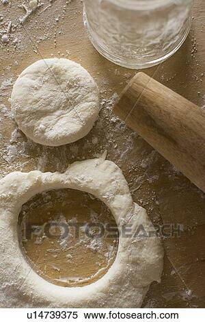 Circle cut out from fresh dough View Large Photo Image Stock Photography - Circle cut out from fresh dough. Fotosearch