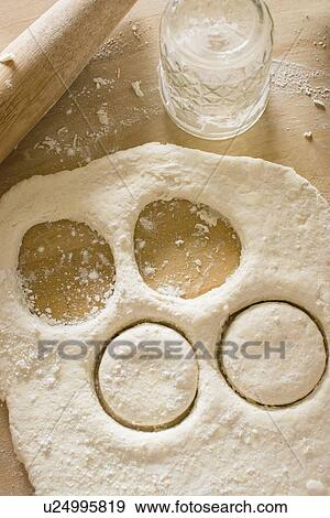 Circles cut out from fresh dough View Large Photo Image Stock Photo - Circles cut out from fresh dough. Fotosearch