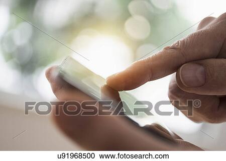 Close up of man's hand using smartphone View Large Photo Image Stock Image - Close up of man's hand using smartphone. Fotosearch