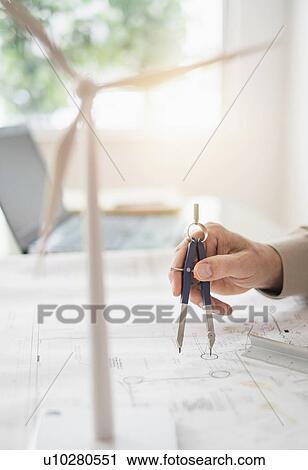 Close up of man's hands using compass while drawing plans View Large Photo Image Stock Image - Close up of man's hands using compass while drawing plans. Fotosearch